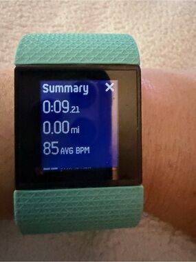 fitbit Smartwatch with Teal Band and Black Face w charge cable
